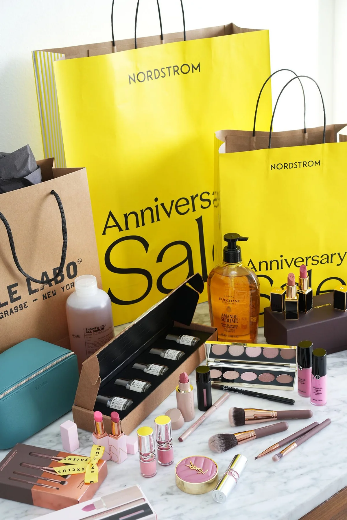 Beauty exclusives from the Nordstrom Anniversary Sale on a marble counter