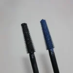 Black and navy RUM Wrap Party mascara wand bristles side by side
