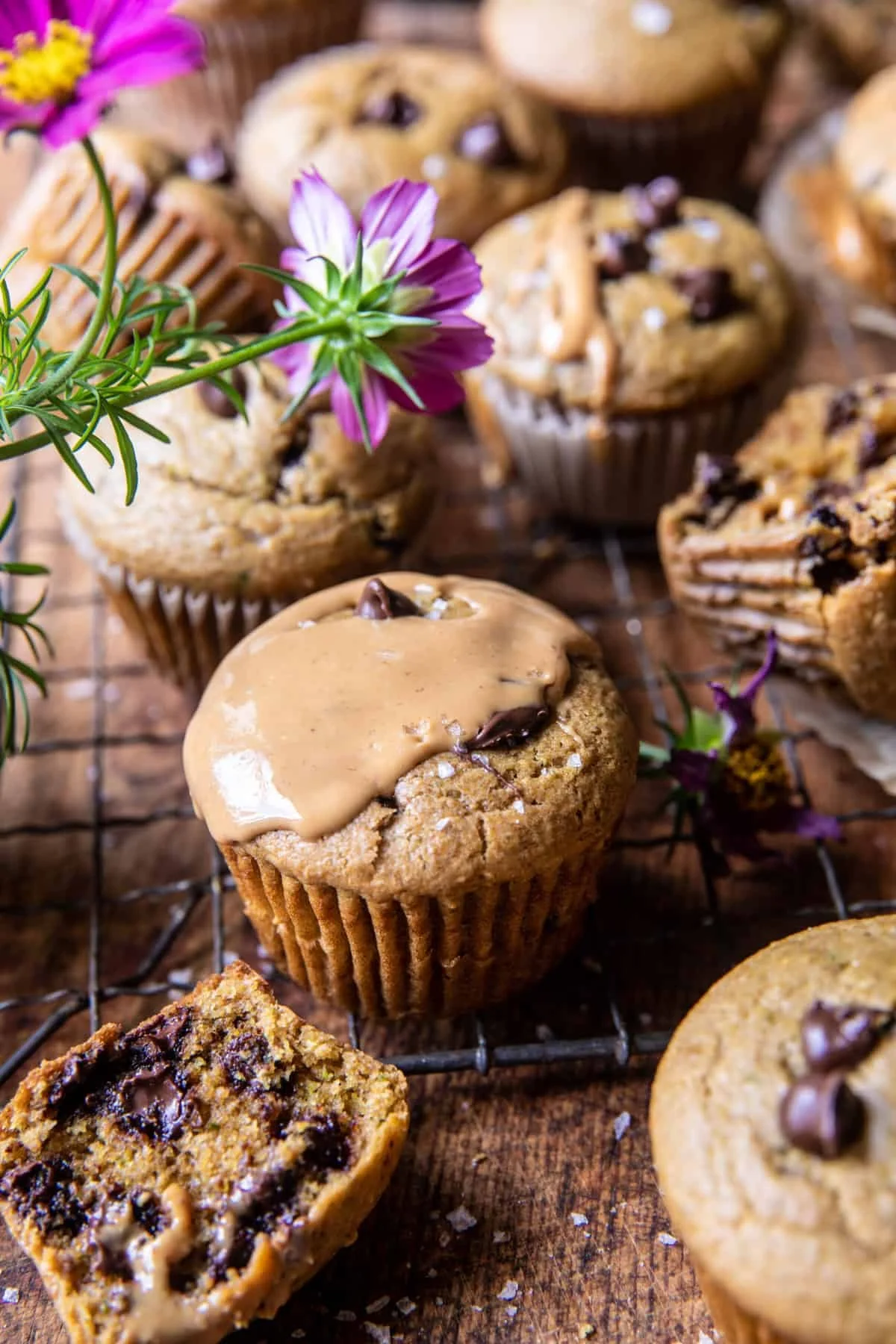 Chocolate chip peanut butter zucchini muffins with glaze and fresh flowers