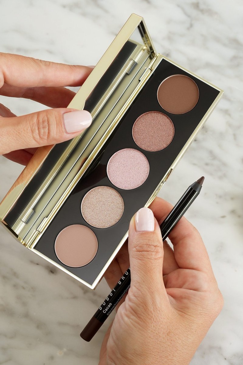 Open Bobbi Brown eyeshadow palette with liner pencil