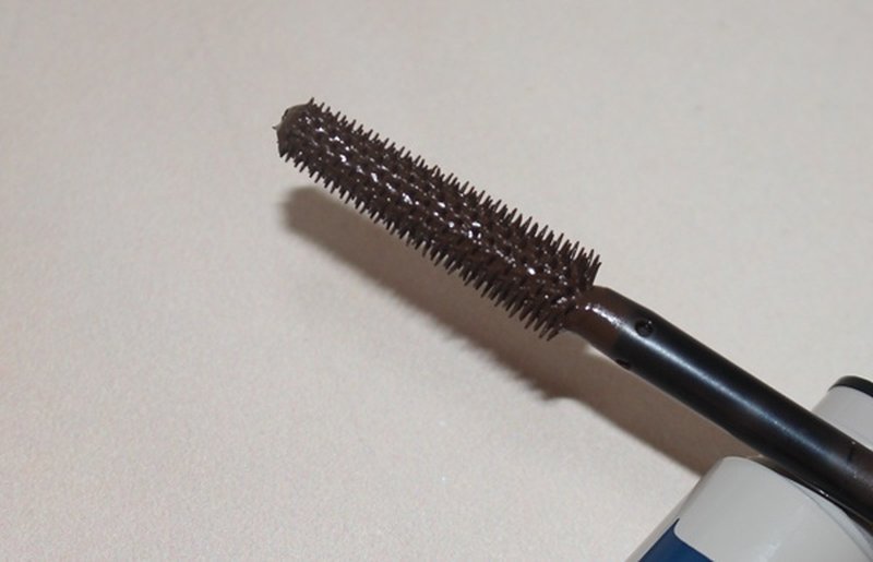 Close-up of RUM Wrap Party mascara brush coated in product