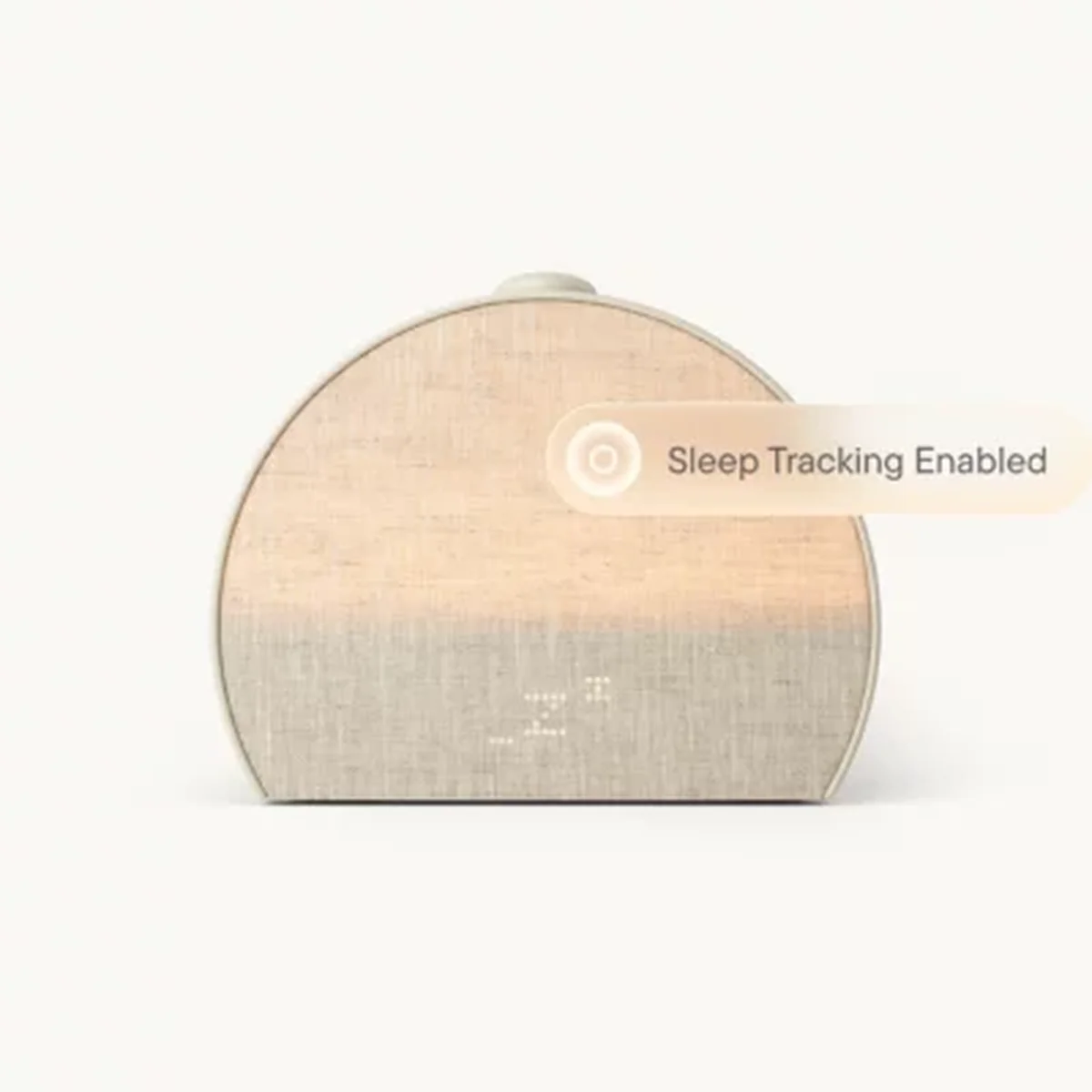 Wellness product grid: body oil, sleep clock, and bath towel arranged on a bright shelf