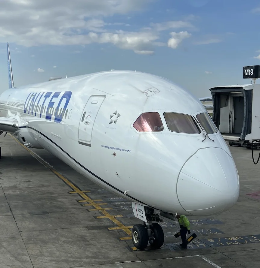 Close-up of a United 787 nose and cockpit at the gate