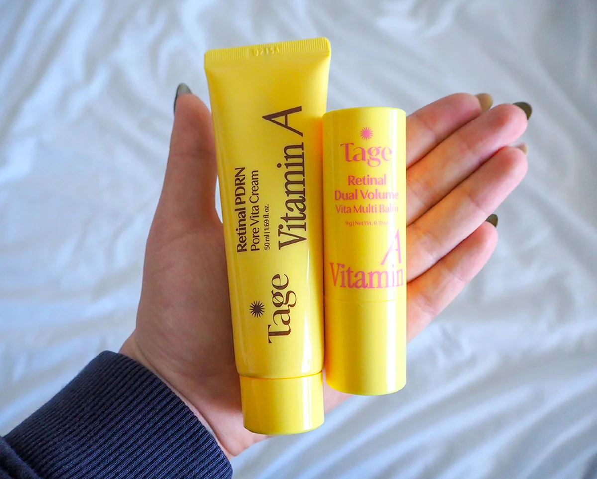 Hand holding both Tage retinal skincare products for scale