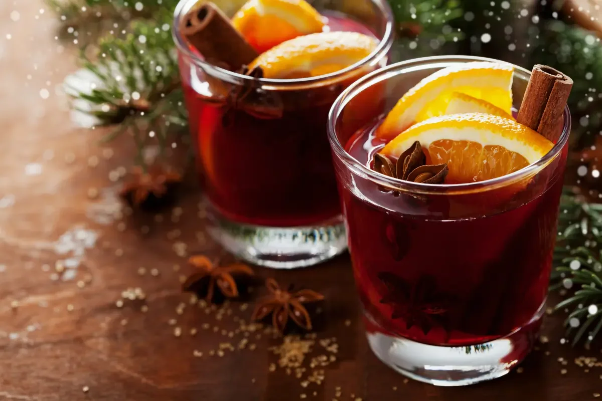 Two glasses of mulled wine with orange, cinnamon, star anise